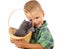 Little boy with gray kitty in wicker