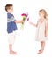 Little boy handing flowers to little girl