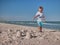 Little boy having on beach fun with the sand. Baby playing on the seaside in summertimes. Summer rest concept. Happy