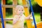 Little boy having fun and eating big lollipop on outdoor playground