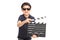 Little boy having fun with a movie clapperboard