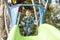 Little boy having fun on a playground outdoors in summer. Toddler on a slide.