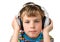 Little boy and in headphone puts hands on it