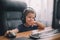 Little boy with headset using computer