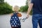 Little boy with his father going to school after summer break. Education for little kids. Education for kids