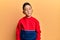 Little boy hispanic kid wearing casual sweatshirt with serious expression on face
