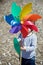 Little boy holding colored pinwheel