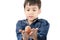 Little boy holding egg in hand healthy on white background