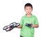 Little boy holding a radio remote control (controlling handset)