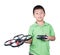 Little boy holding a radio remote control (controlling handset) for helicopter , drone or plane Isolated