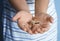 Little boy holding wooden cross, closeup