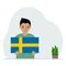 A little boy holds the flag of Sweden in his hands. The concept of demonstration, national holiday or patriotism