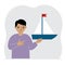 A little boy holds a sailing yacht in his hand. Concepts of freedom, hope and big plans. Hobby.