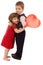 Little boy hugging girl with red balloon