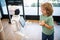 little boy interact with robot artificial intelligence, future tech