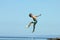 Little boy jumps in sea