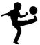 Little boy kick soccer ball outdoor silhouette.