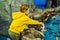 Little boy, kid watching the shoal of fish swimming in oceanarium, children enjoying underwater life in Aquarium