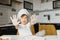 Little boy in kitchen.Cute boy wears a chef hat and apron