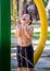 Little boy laughing in a summer fountain