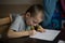 Little boy learns to write homework