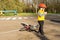 Little boy leaving his bike on the roadside