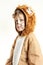 Little boy in lion coat looking to the left