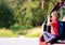 Little boy looking through binoculars travel by car