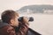 Little boy looking by binoculars during trip on Danube, Budapest