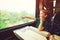 Little boy looking out train window. Kid pointing outside from train window. Family vacations and traveling by railway in summer.