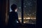 Little boy looking out window into starry night sky, Generative AI