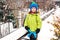 Little boy makes snowballs with snowball maker. Happy child playing with snow. Cold winter weather. Winter activities for kids