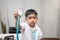 Little boy in medic uniform holding a stethoscope