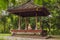 Little boy meditate practicing yoga in the traditional balinesse gazebo