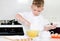 Little boy mixing cake ingredients