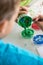 Little boy mixing paints for his art class