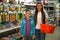 Little boy and mother near shelves with school stationery