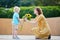 Little boy offering bunch of sunflowers to his mom