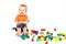 Little boy in an orange shirt is played Lego