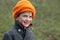 Little boy in orange woollen hat