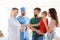 Little boy with parents visiting children`s doctors