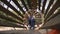 A little boy passes obstacles in a rope Park, he climbs through a wooden tunnel.