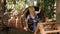 Little boy passes obstacles in a rope Park, he climbs through a wooden tunnel.