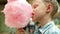 Little boy with pink cotton Candy portrait