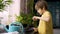 Little boy planting seedlings at home. An independent child is busy with a hobby with potted plants. Lifetime concept