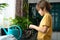 Little boy planting seedlings at home. An independent child is busy with a hobby with potted plants. Lifetime concept