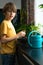 Little boy planting seedlings at home. An independent child is busy with a hobby with potted plants. Lifetime concept