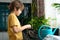 Little boy planting seedlings at home. An independent child is busy with a hobby with potted plants. Lifetime concept