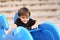 Little boy on playground equipment