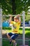 Little boy at playground plays sports. Fitness motivation